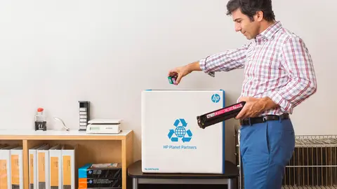 Business Man Recycling in HP Planet Partners Recycle Box