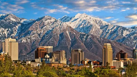 Skyline of downtown Salt Lake City with the Towering Wasatch Mountain range in the background
